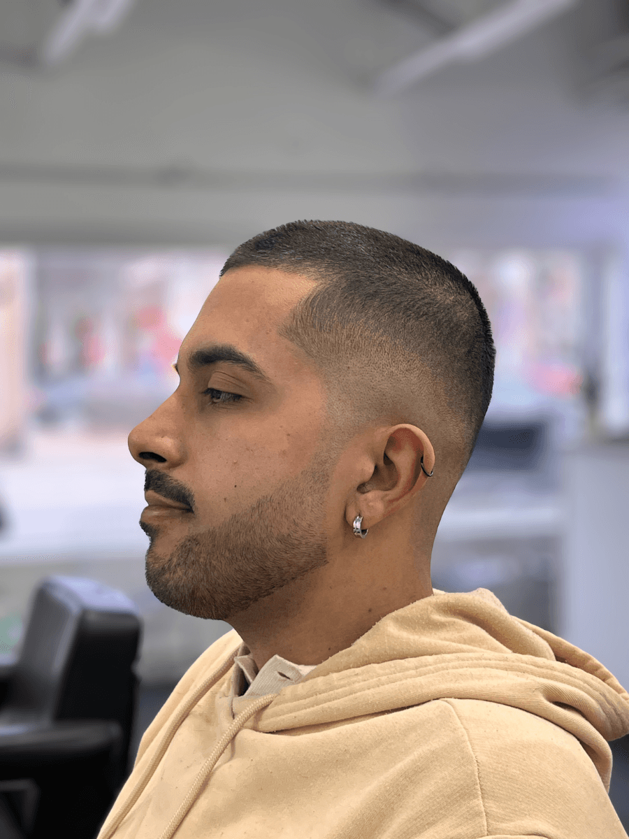 woman in red long sleeve shirt holding hair blower