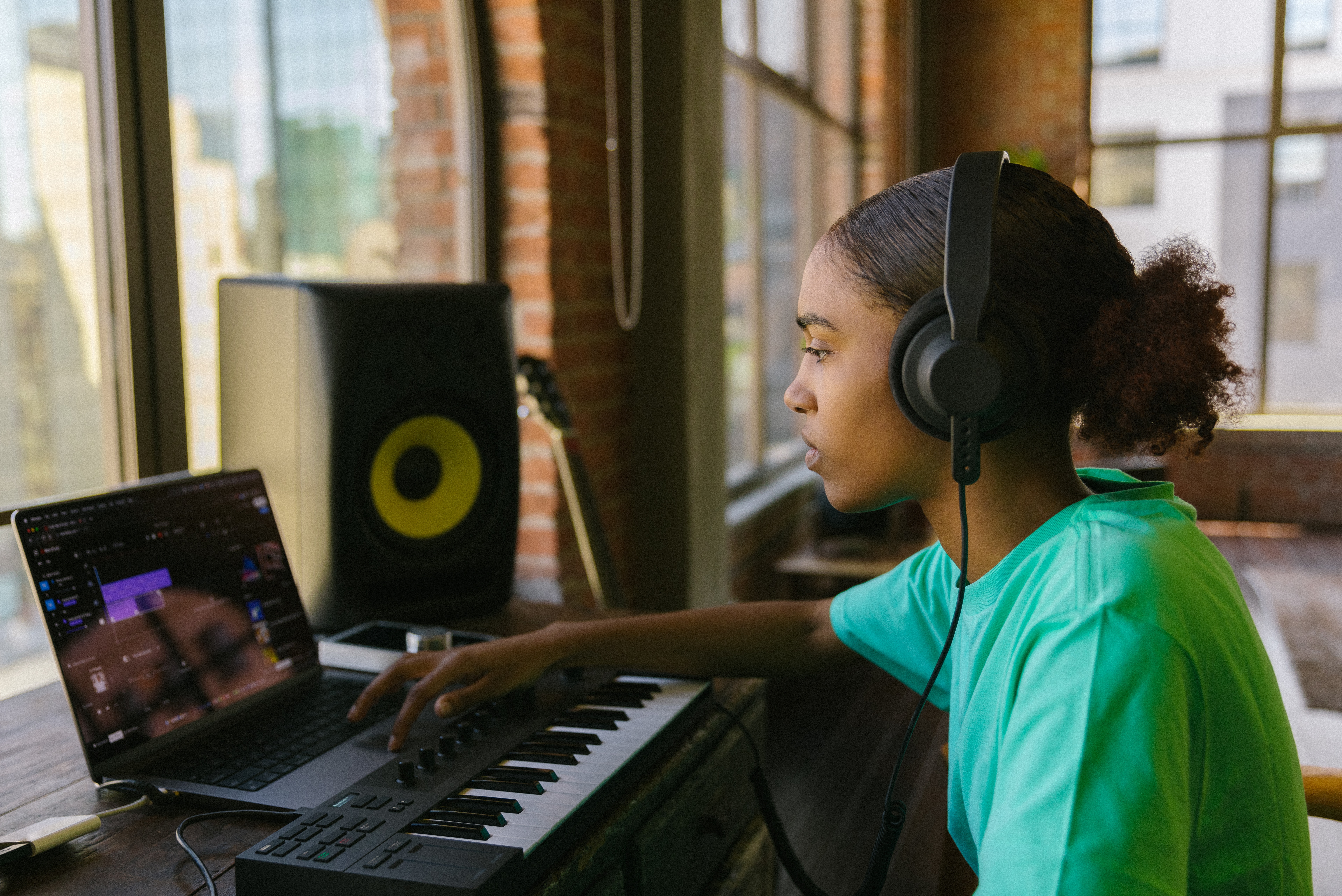 woman on laptop loooking for features on Amper Music