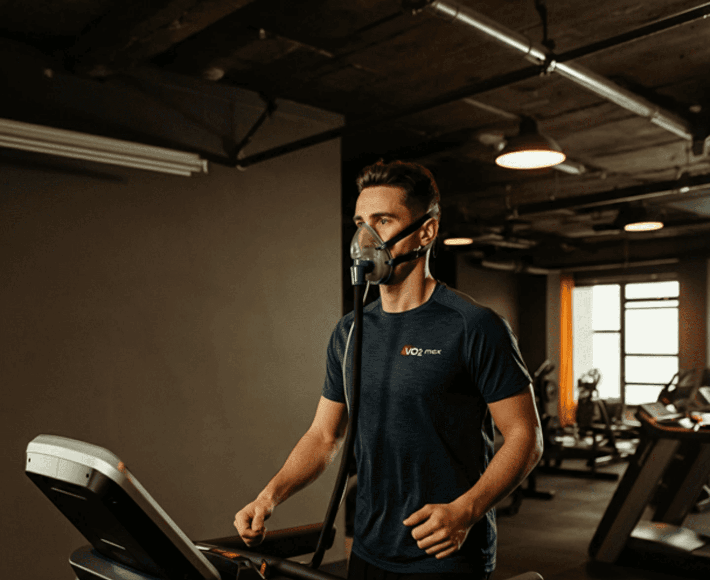 Image with person taking a VO2 max test with mask on