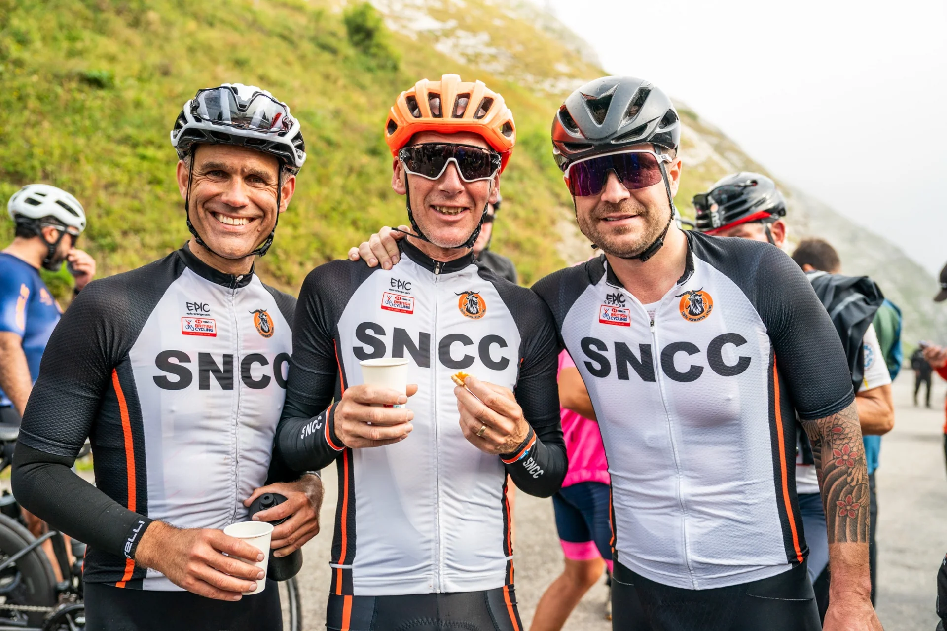 Smiling SNCC team after a stage of the Haute Route Alps - team spirit and performance
