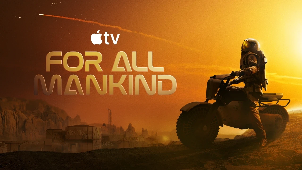 A person in a space suit rides an all-terrain vehicle across a rugged, reddish Martian landscape at sunset, with a streaking meteor in the sky and the text "For All Mankind" from Apple TV visible.