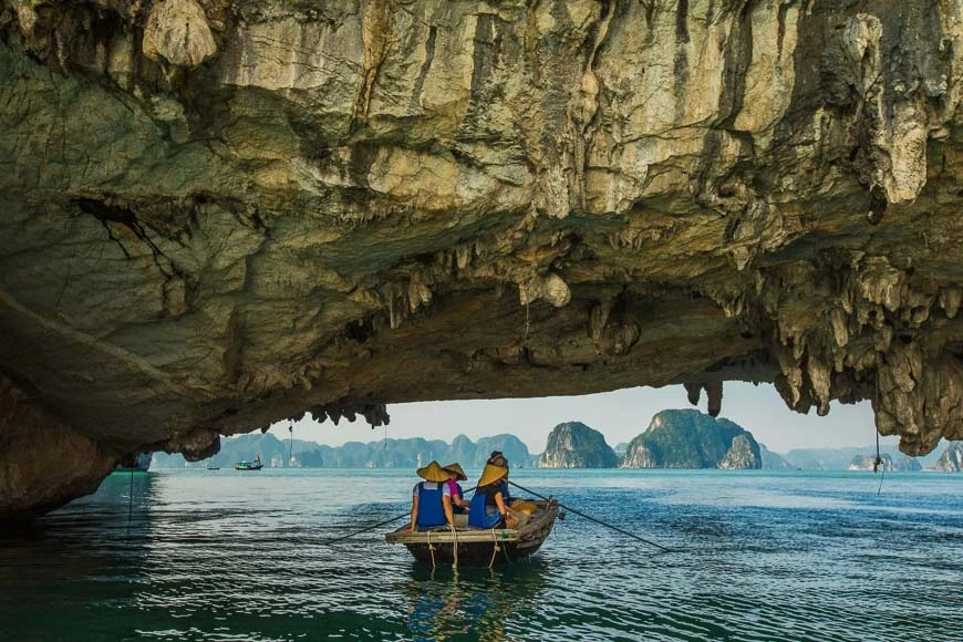 Boat beneath limestone cave