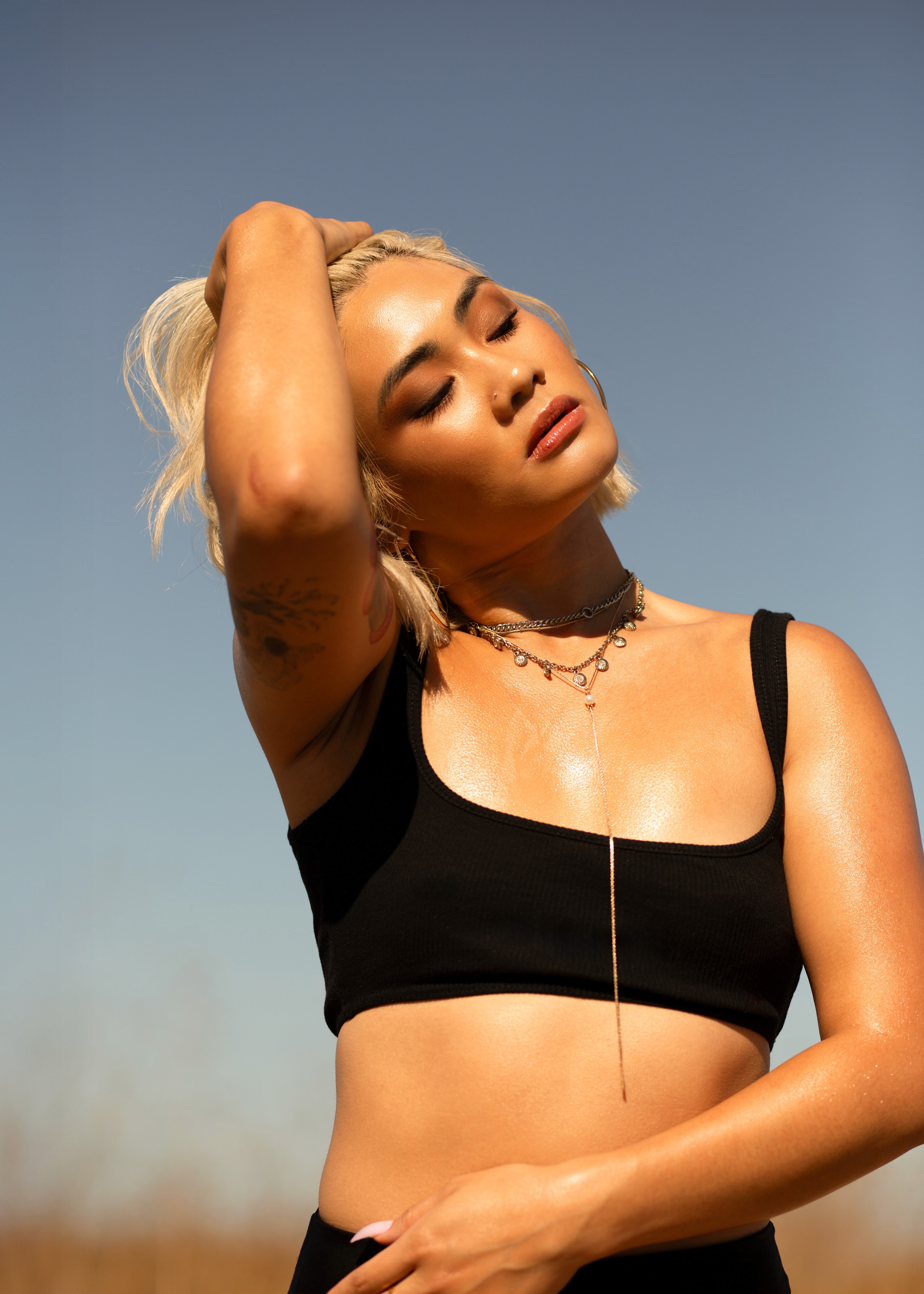 Model embracing the sun warmth