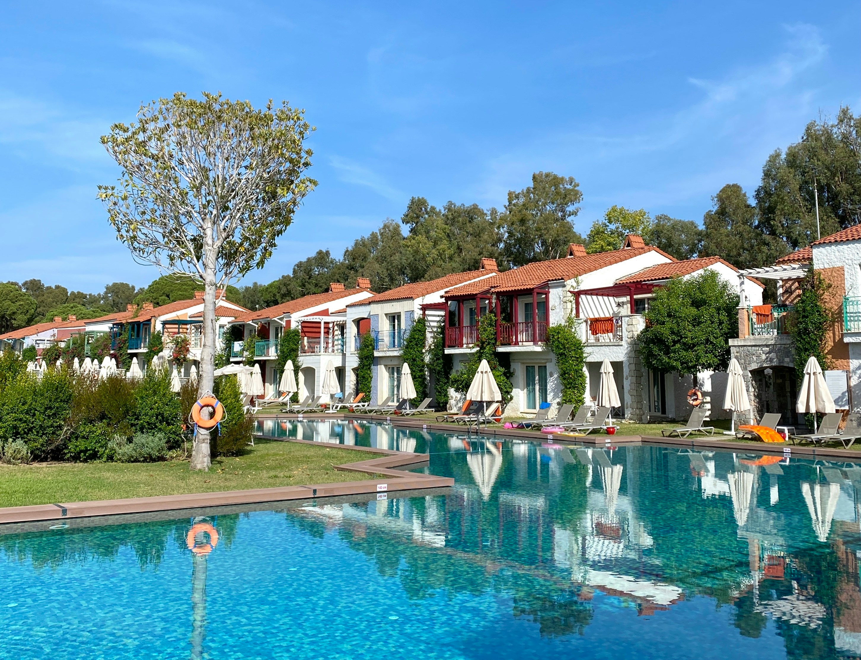a row of houses next to a swimming pool