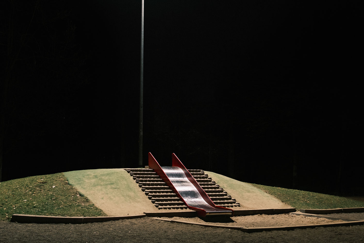 A slide at night in a playground