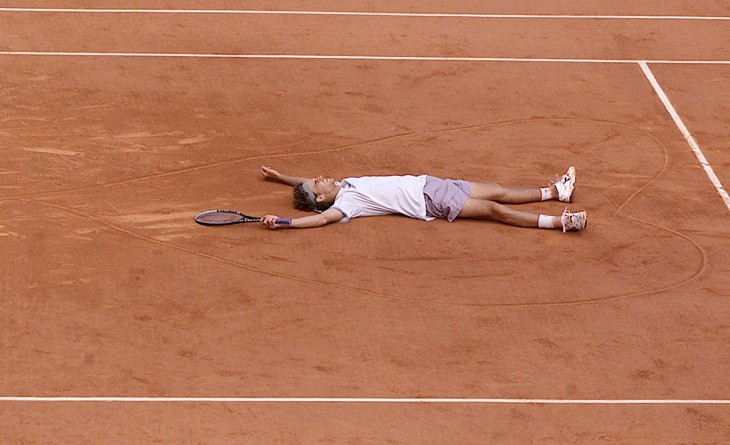 A kid practicing surfing
