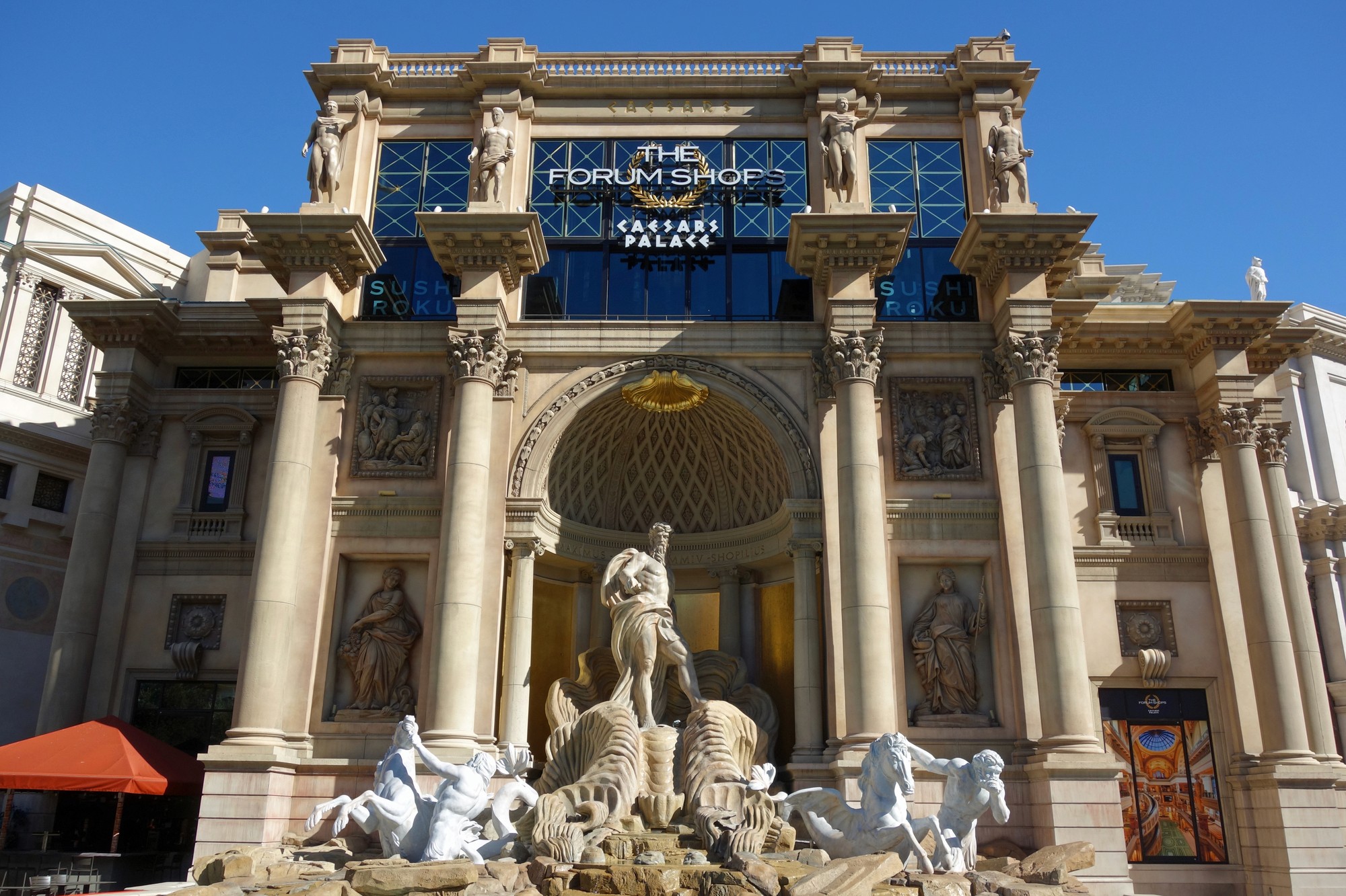brown wooden beach lounge chair on beach during daytime