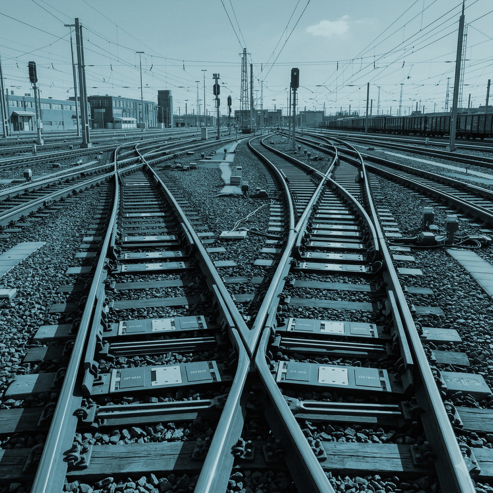 Image of train tracks crossing each other in confusing fashion.