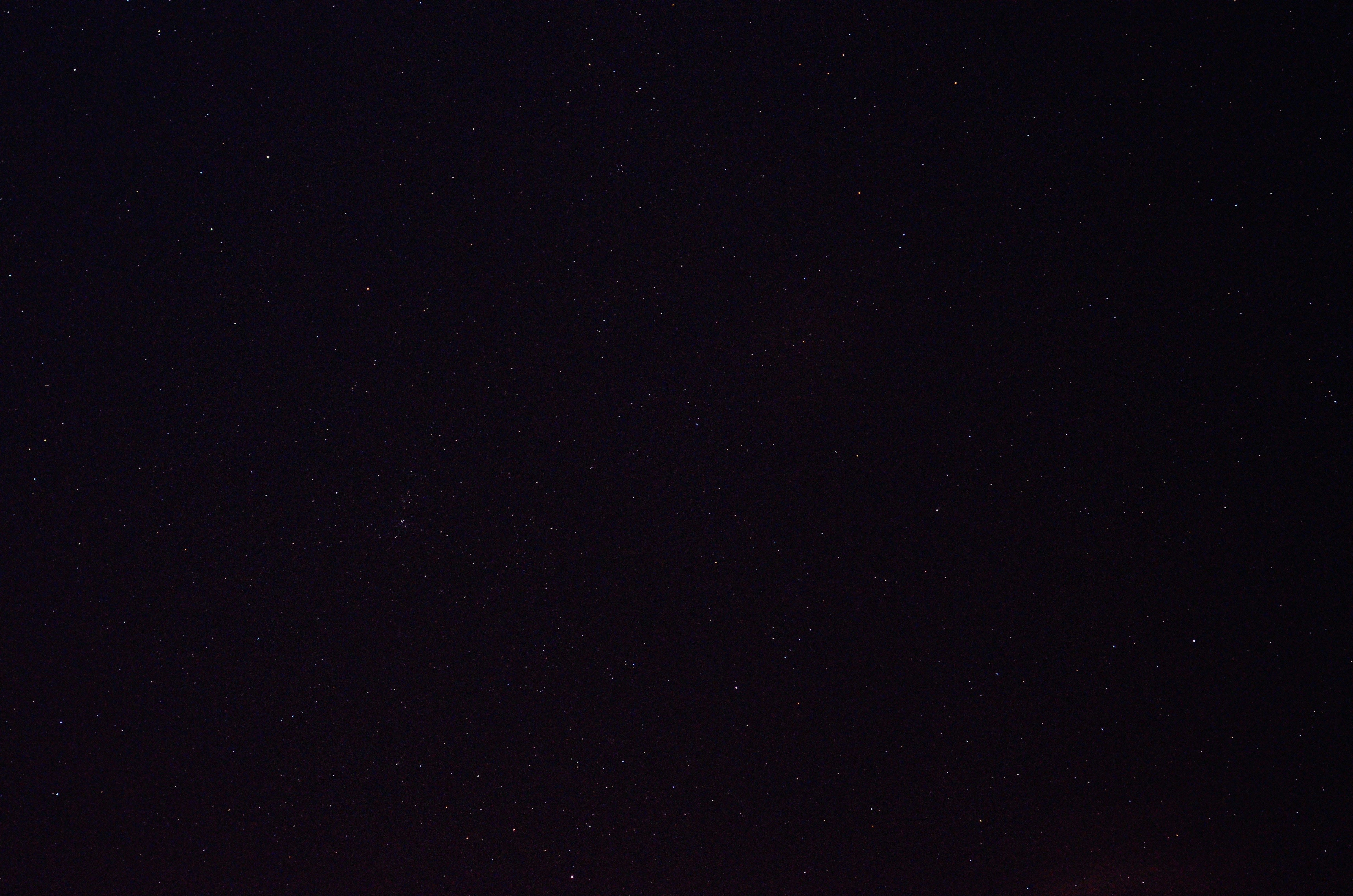 a night sky with a few stars in it