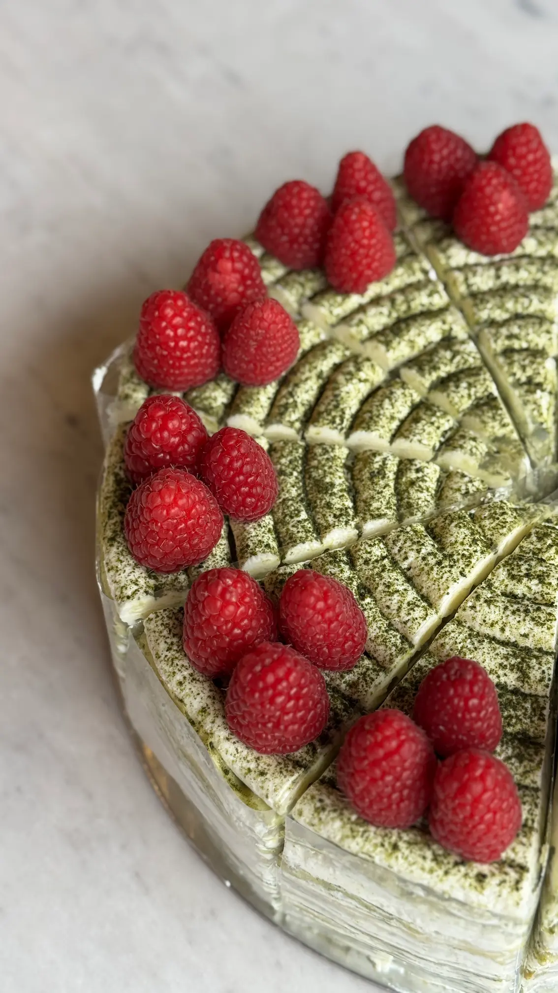 a person swimming in the water with grass