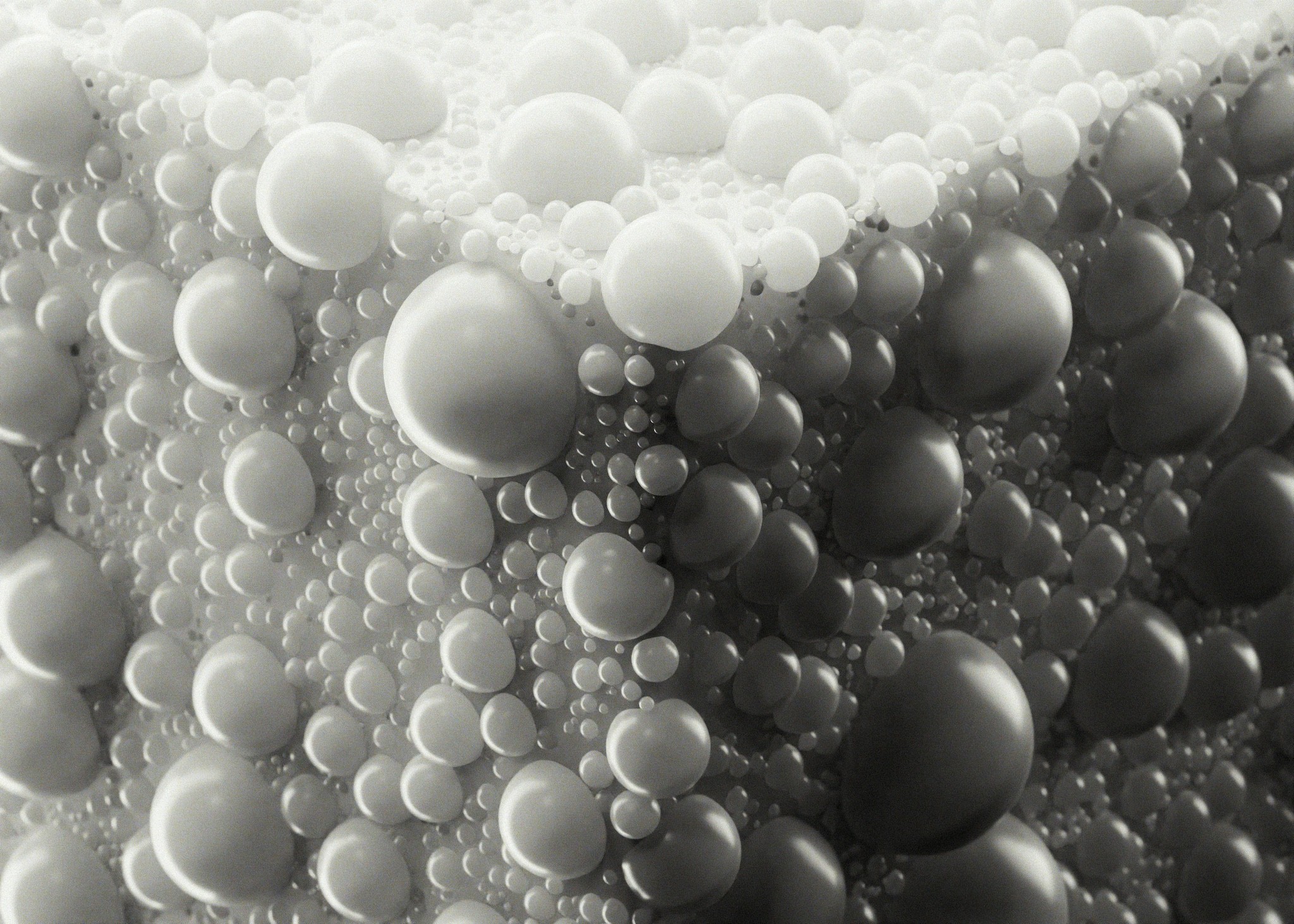 Abstract pattern of many small and large spheres.
