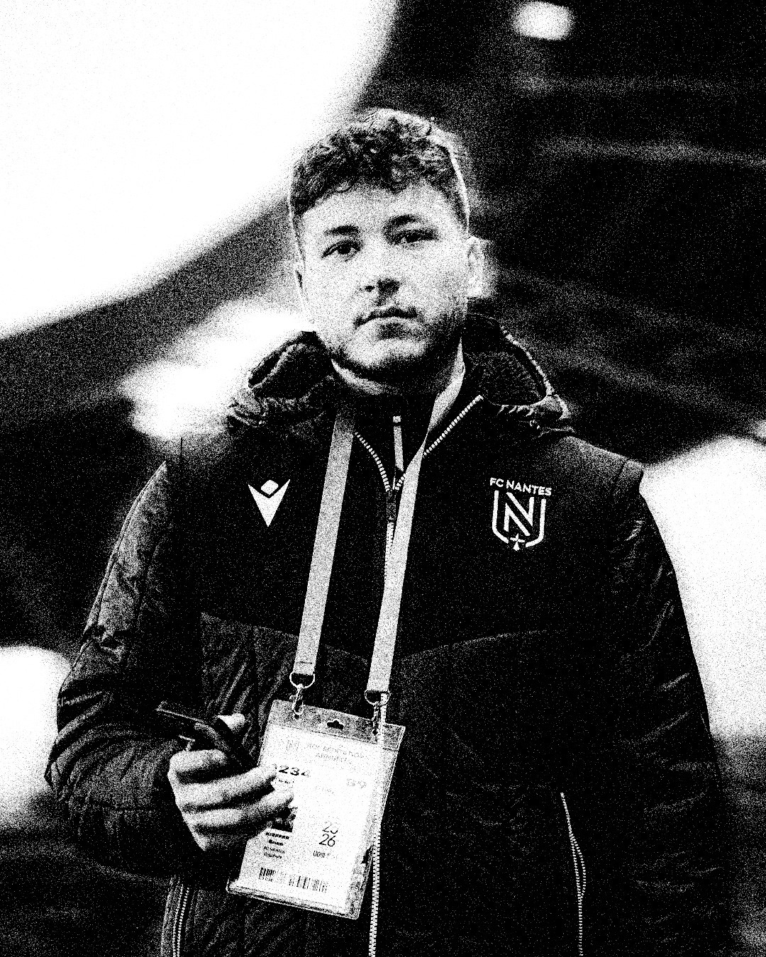 a blurry photo of a person standing in front of a wall