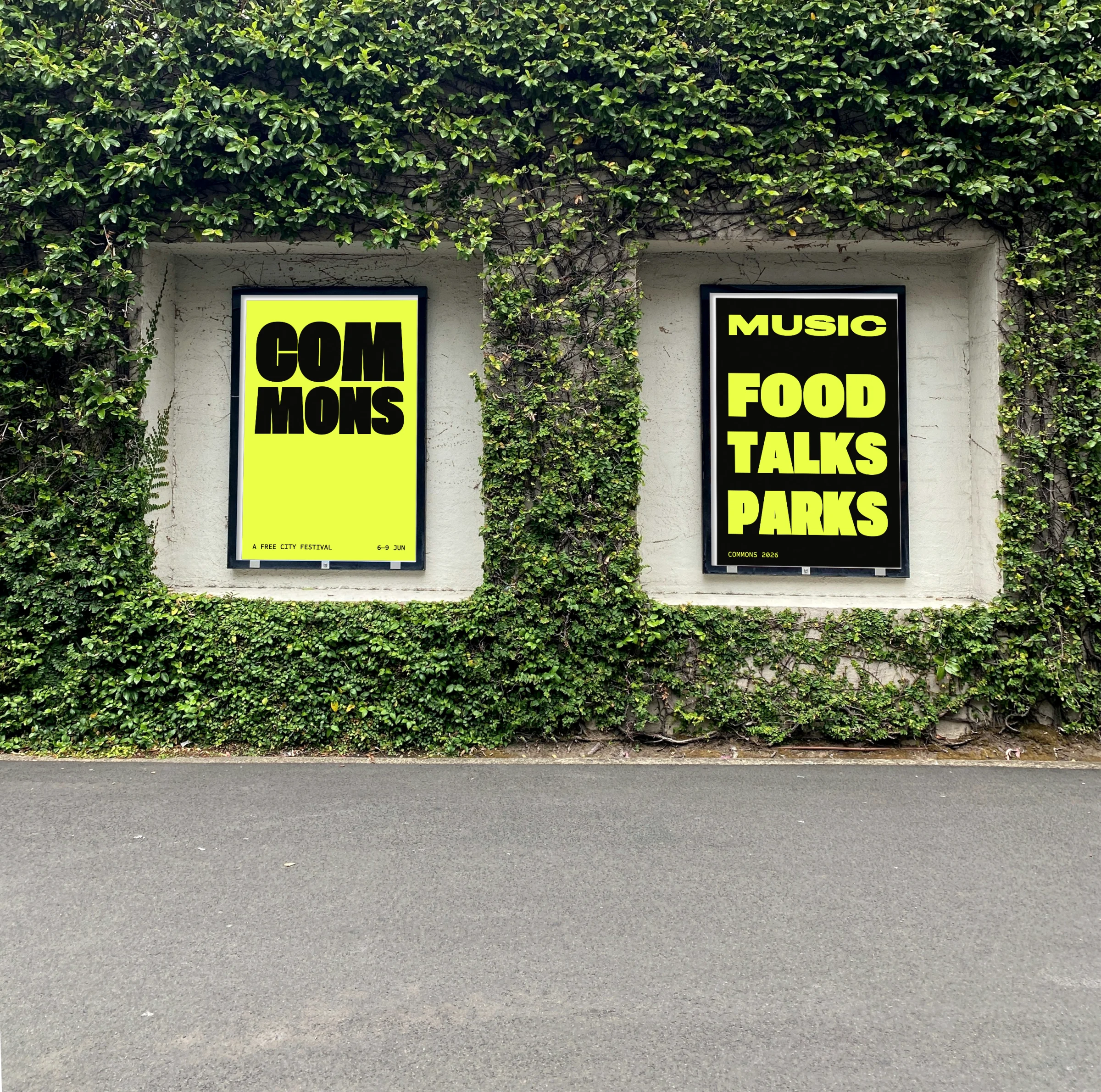Two Commons festival posters in an ivy wall