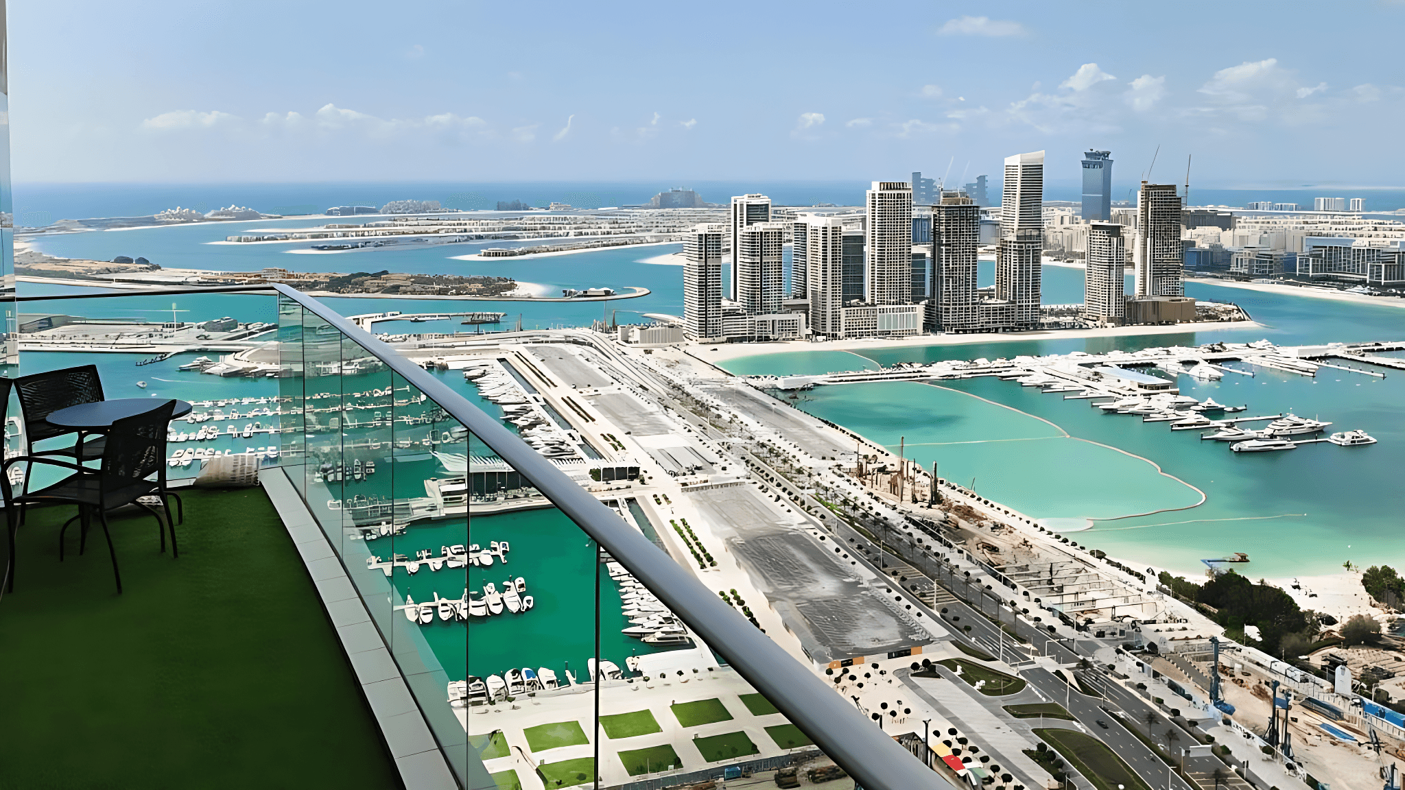 View from a luxury apartment balcony in Dubai, showcasing the skyline and sea from Damac Heights.