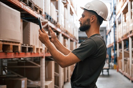 Warehouse worker using TickedOff to manage tasks with a digital checklist