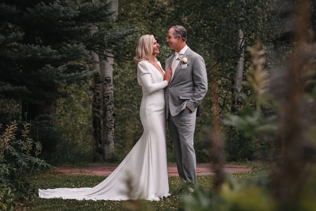 Couple smiling during Bosq Aspen wedding ceremony in nature