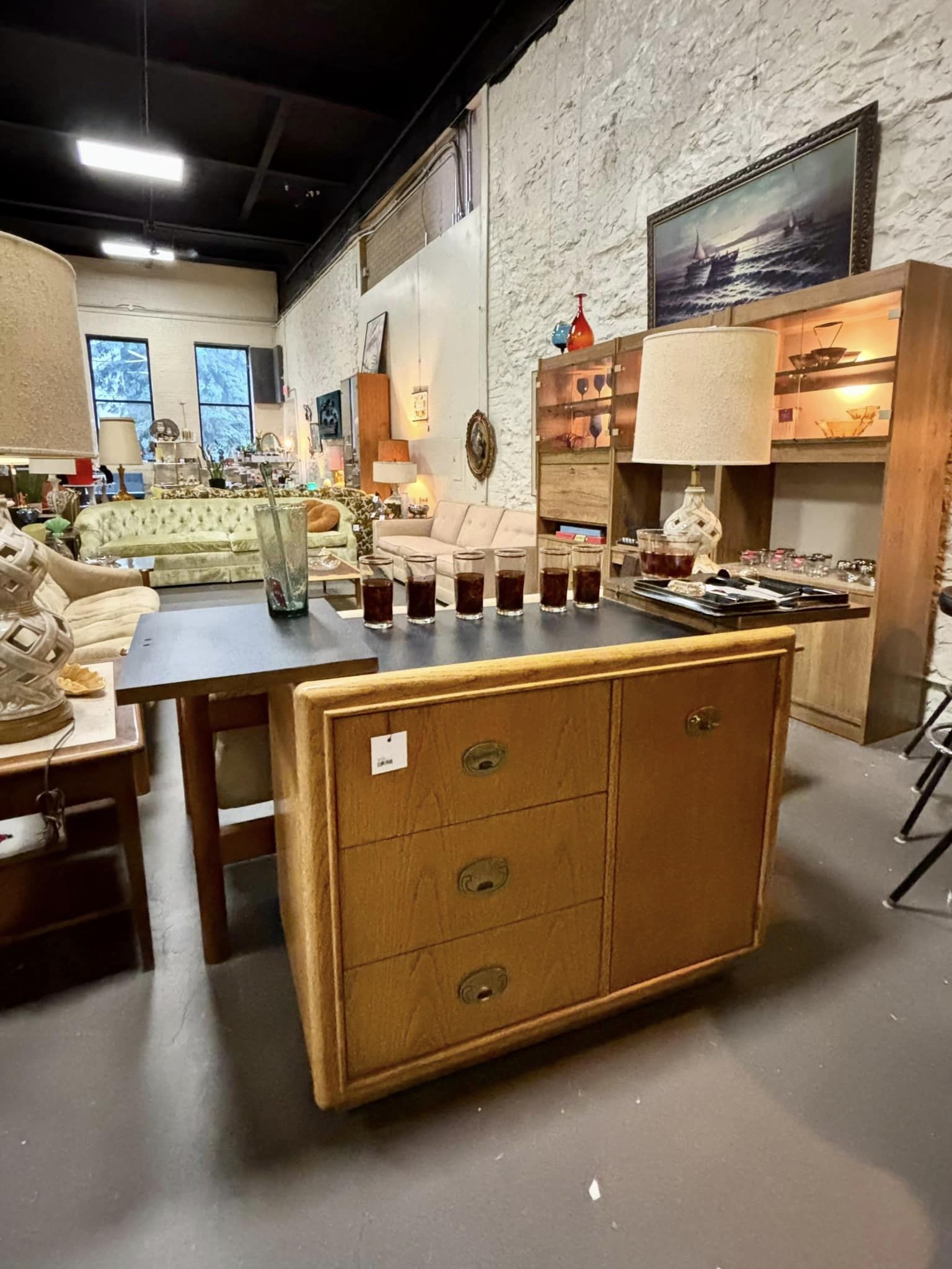 Mid century maximalist dry bar with flip top lid