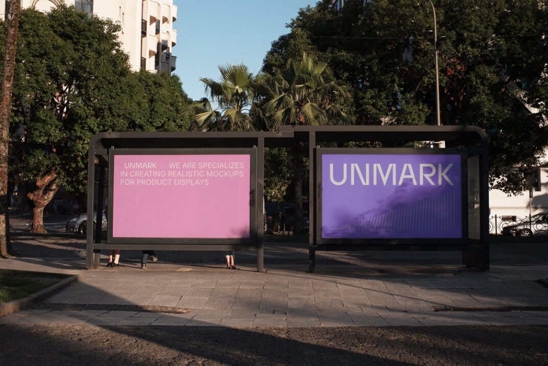 Outdoor billboard mockup featuring two side-by-side posters under a modern black frame in an urban park setting. One poster displays text, while the other showcases a minimalist design. Lit by natural sunlight with tree shadows.