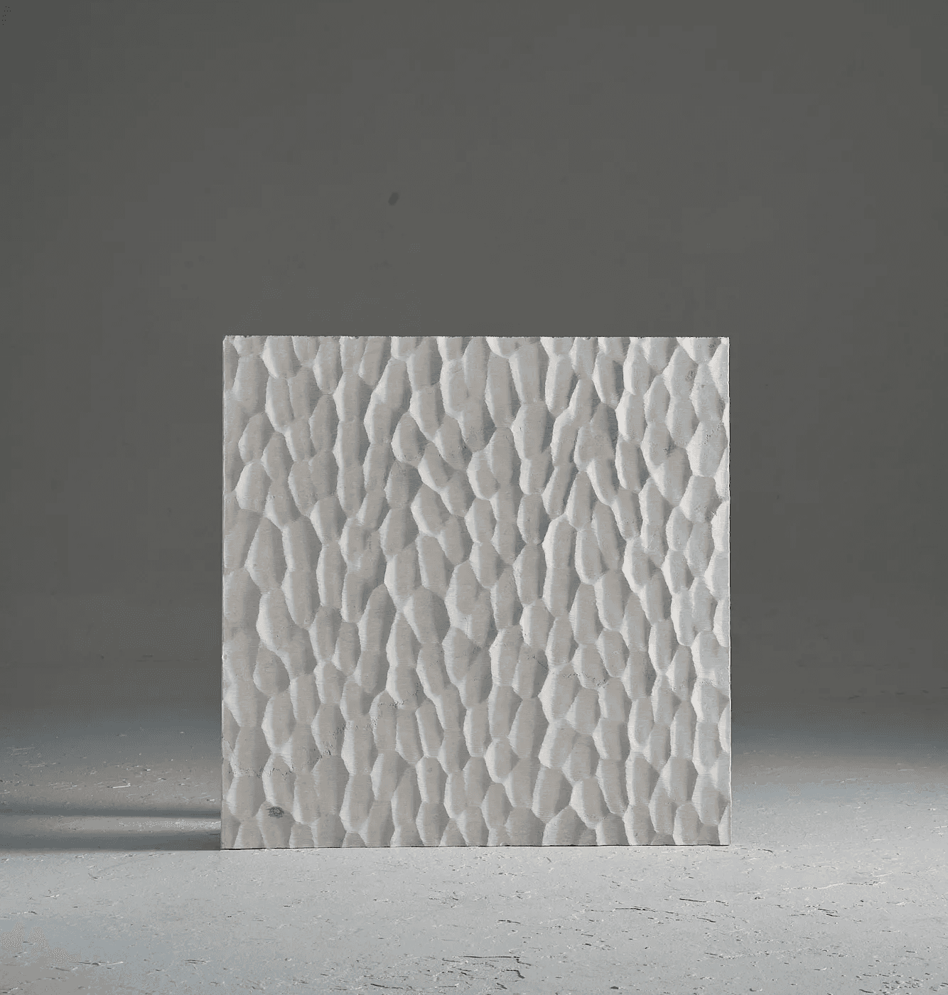 Carved marble surface study inspired by Japanese Naguri woodworking, featuring rhythmic chisel-like marks and repeated relief patterns.