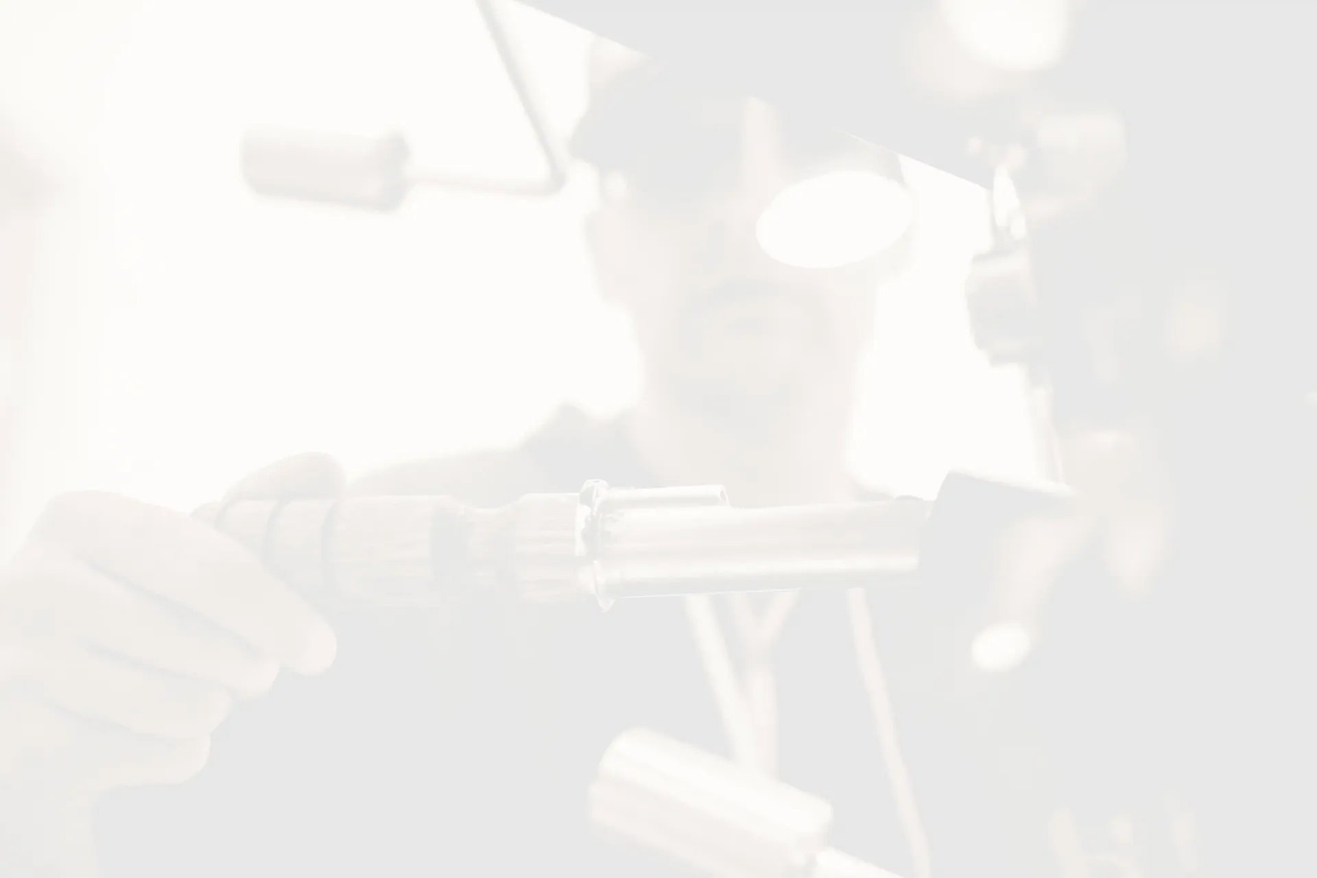 Worker holds tool