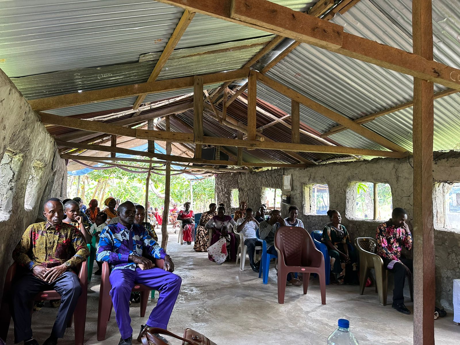 the interior of a church with pews and a gold alter