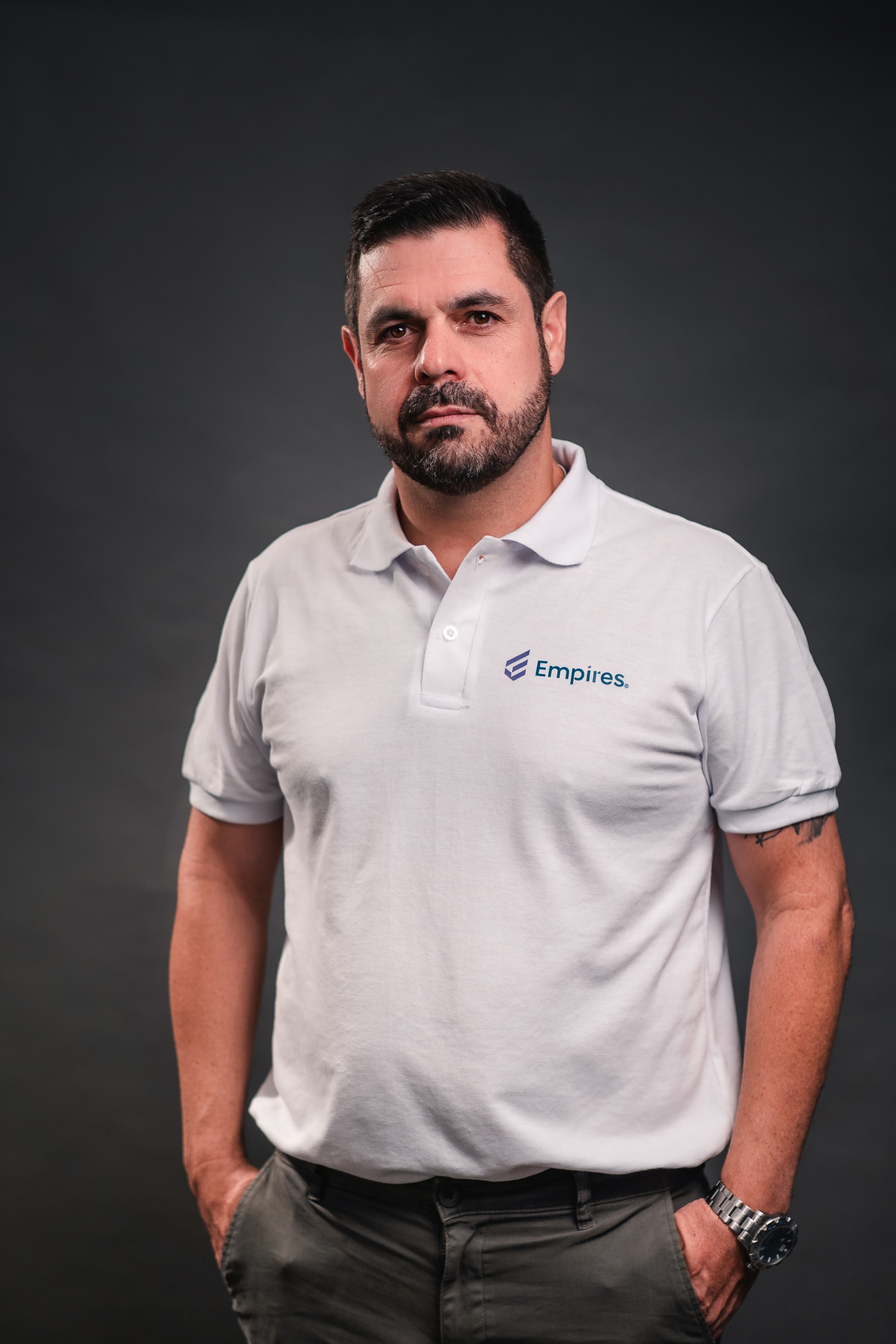 woman in black crew neck t-shirt wearing brown framed eyeglasses standing on rocky shore during