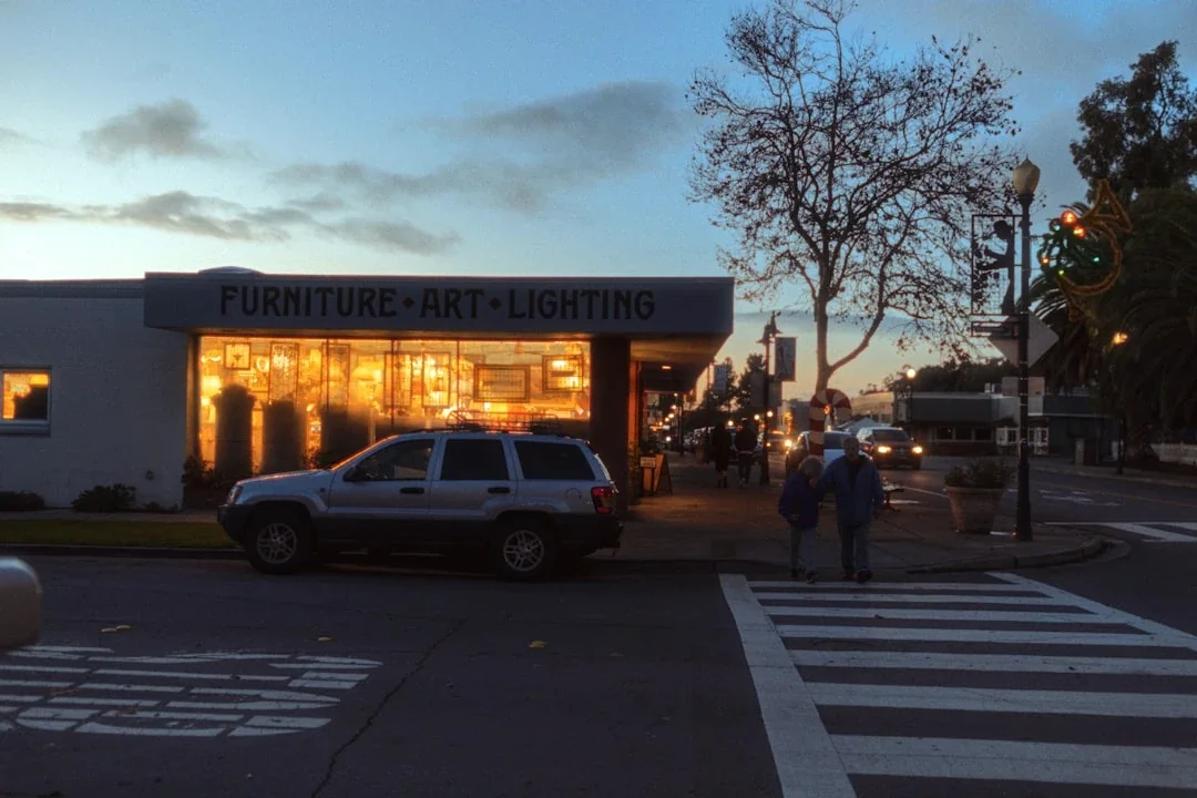 a couple of people that are standing in front of a store