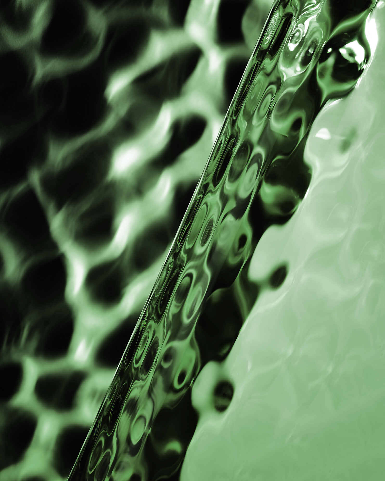 Abstract green texture with wavy patterns and reflective surface.
