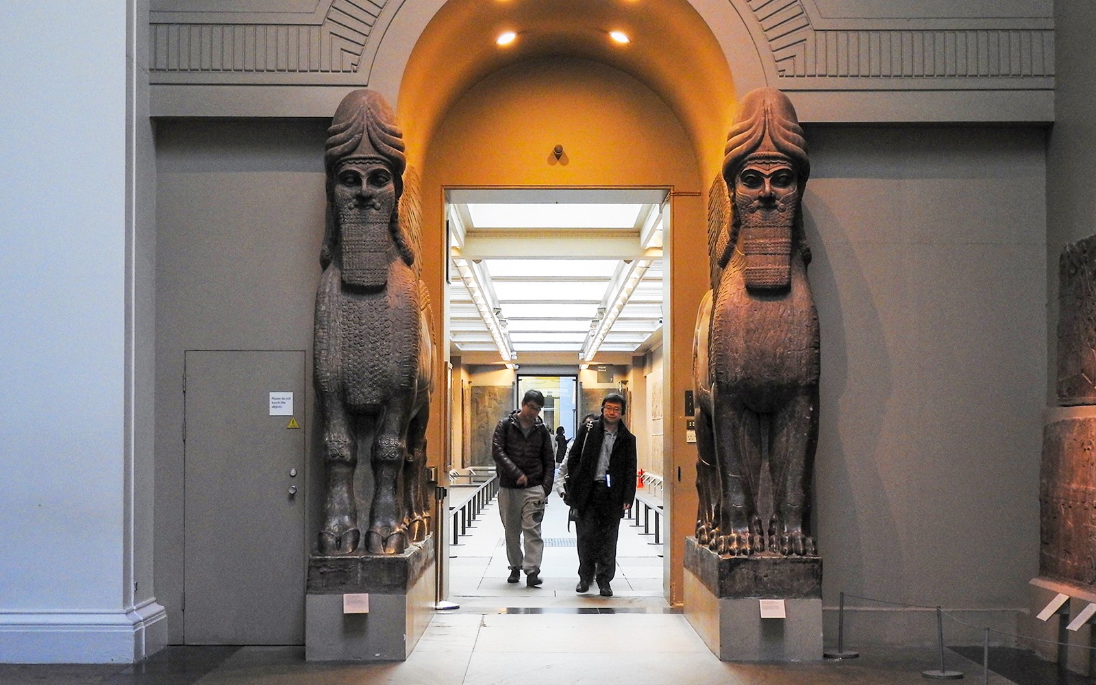 Visitors exploring exhibits in the British Museum during a small-group guided tour in London.