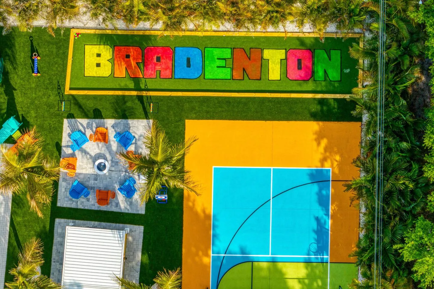 Aerial with court with “BRADENTON” letters on wall at Private Backyard Resort, Bradenton, Florida