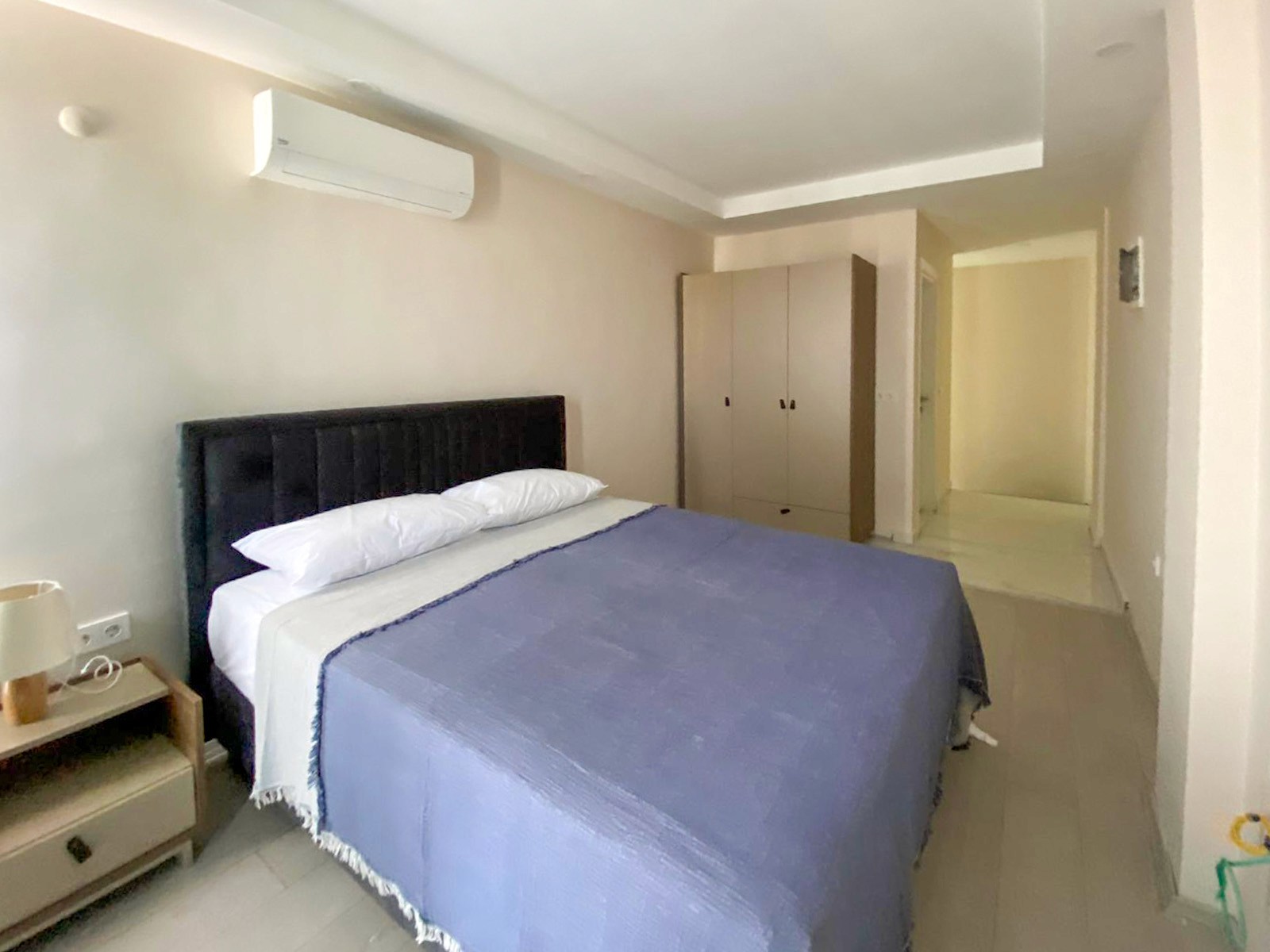 Modern bedroom in duplex 1 bedroom apartment at Zen Garden Suites Side Antalya