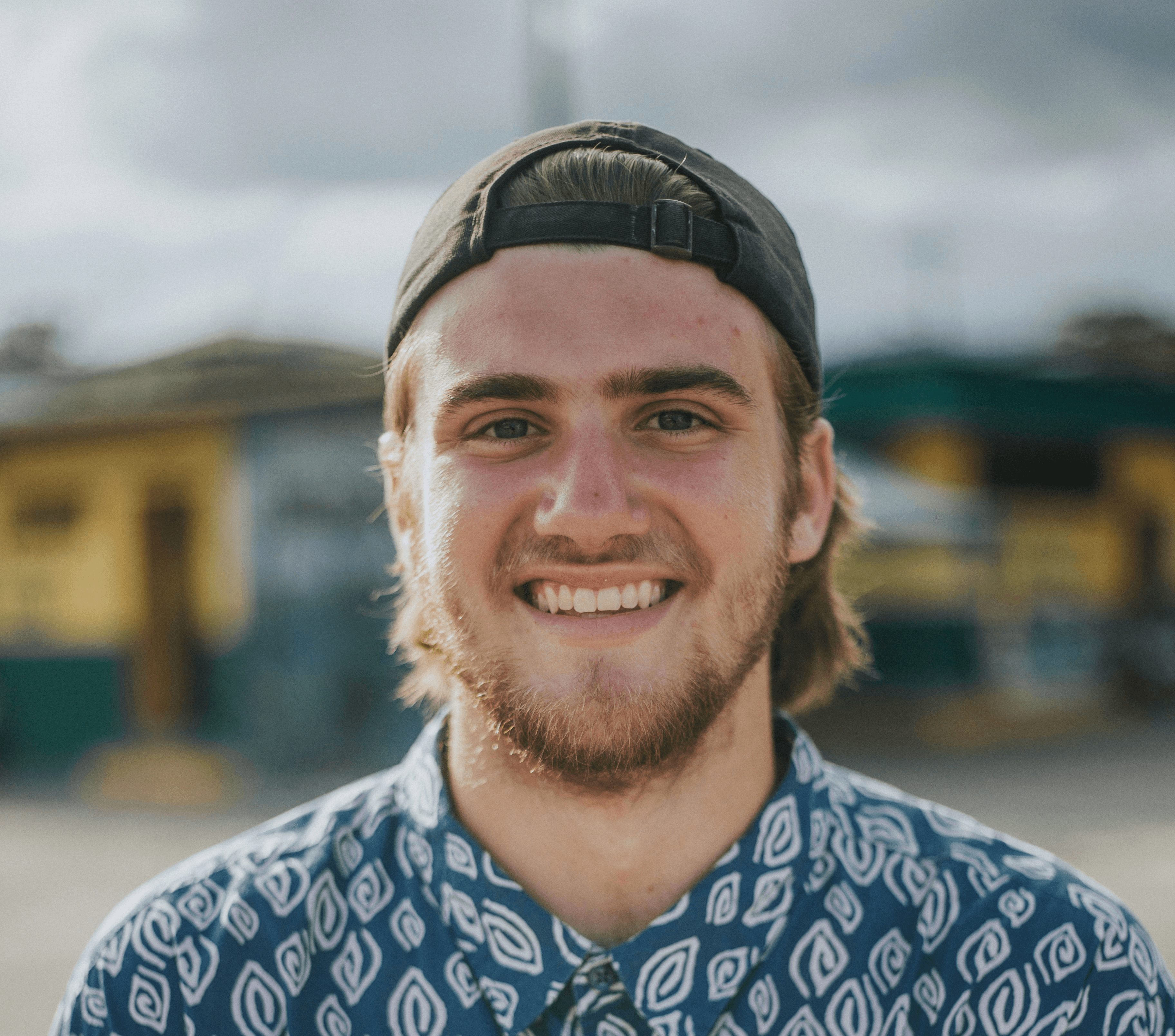 person wearing blue top smiling