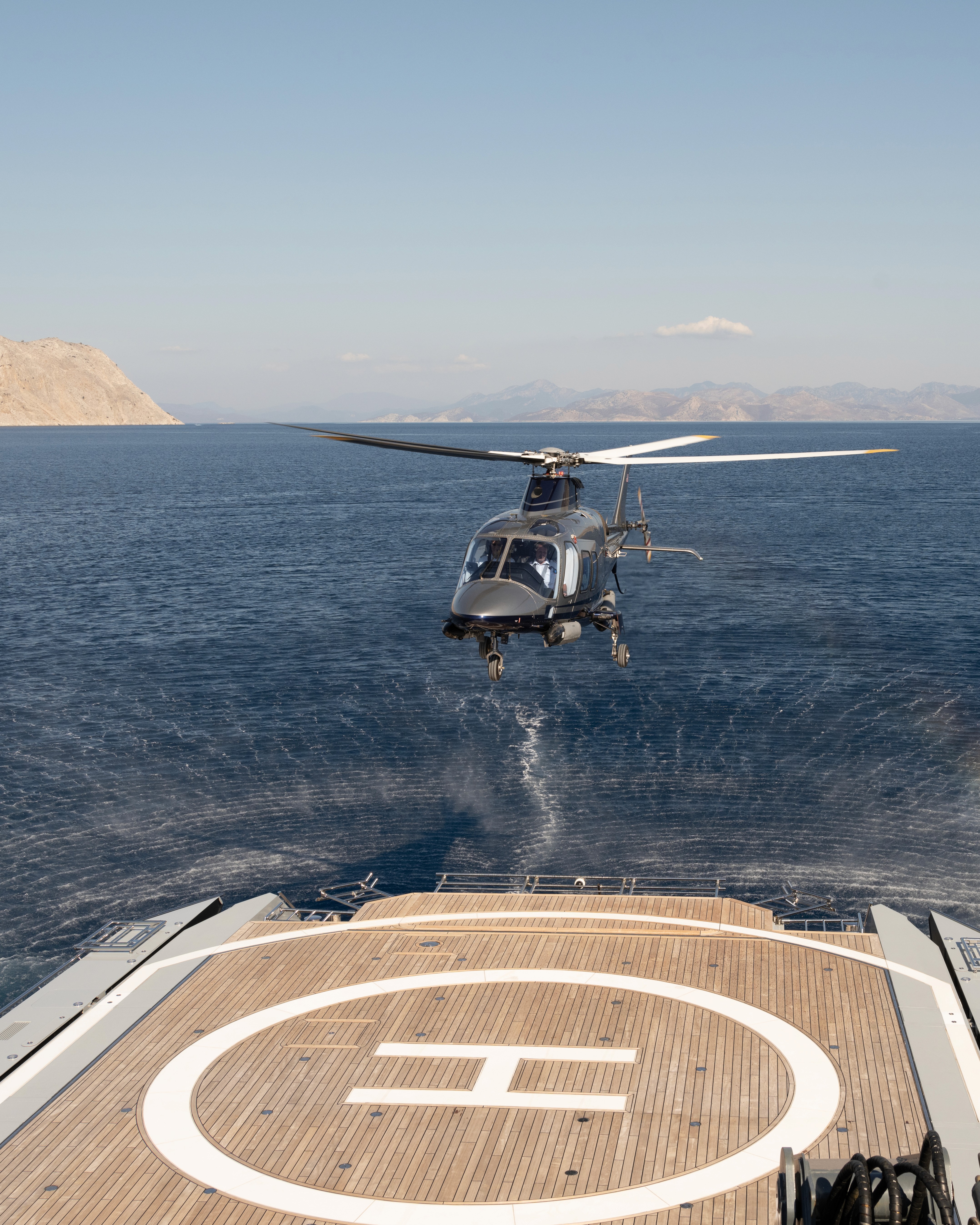 Cozy minimalist reading nook with chair, plant, artwork.