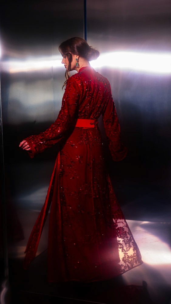 Crimson Moroccan caftan with rich handcrafted detailing, luxury evening wear designed for Bahrain and Gulf clients
