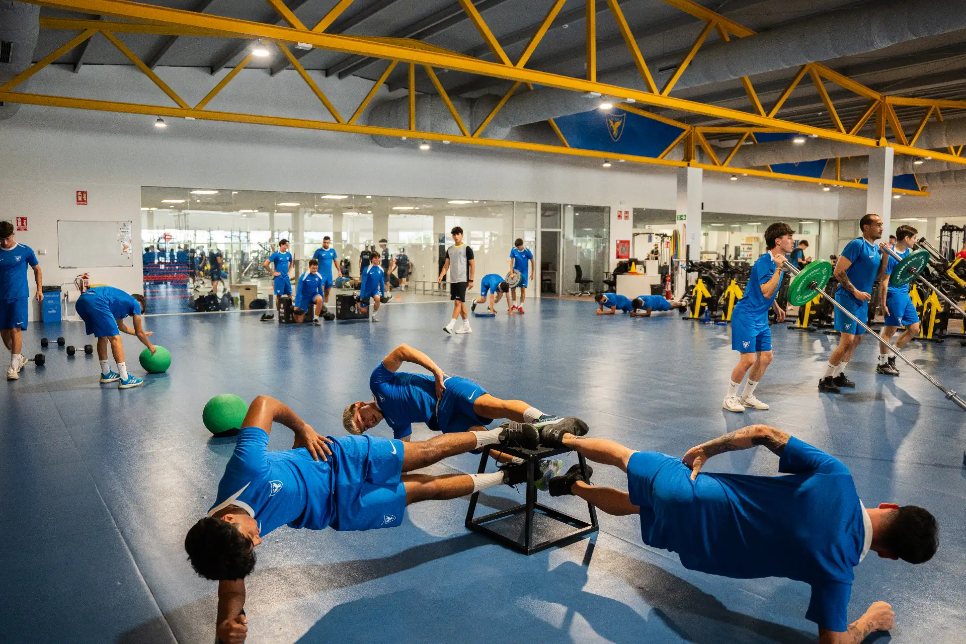 Players of the UCAM International Football Team performing strength exercises at the UCAM Sports Center | UCAM Catholic University of Murcia