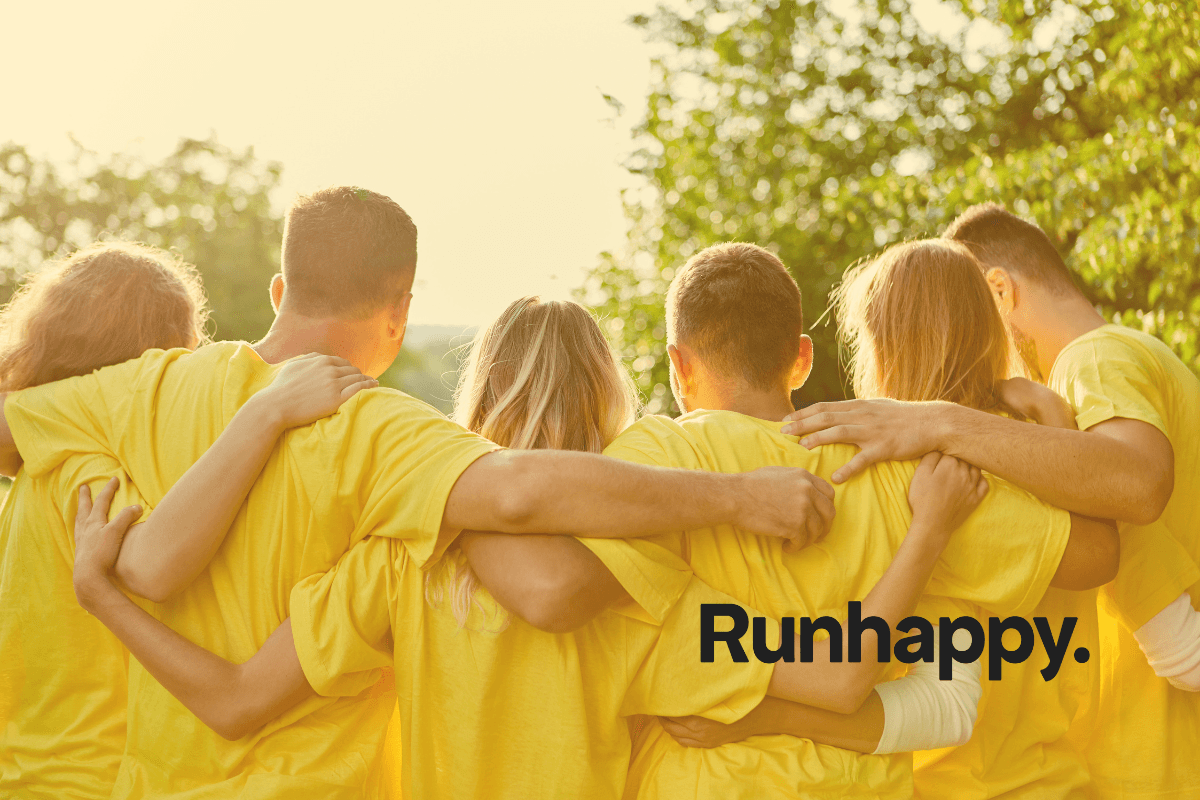A group picture from behind of a corporate group in yellow shirts
