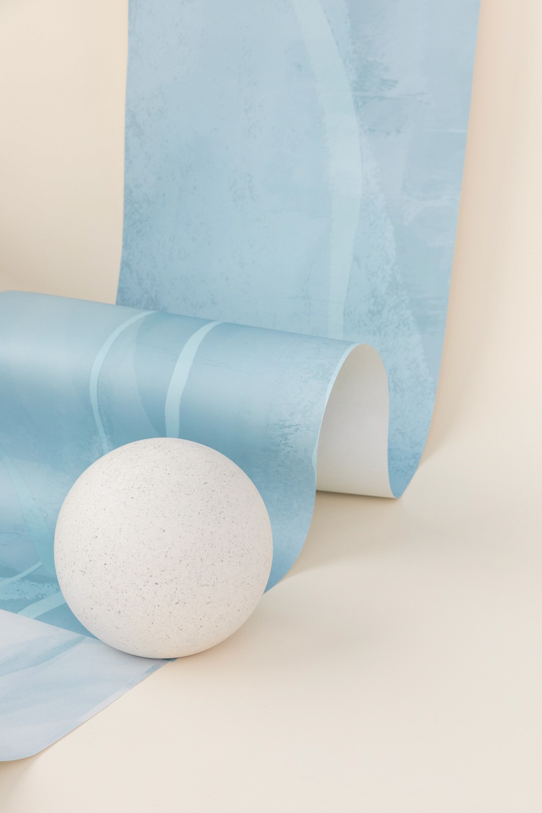blue wallpaper and a sculptural ball
