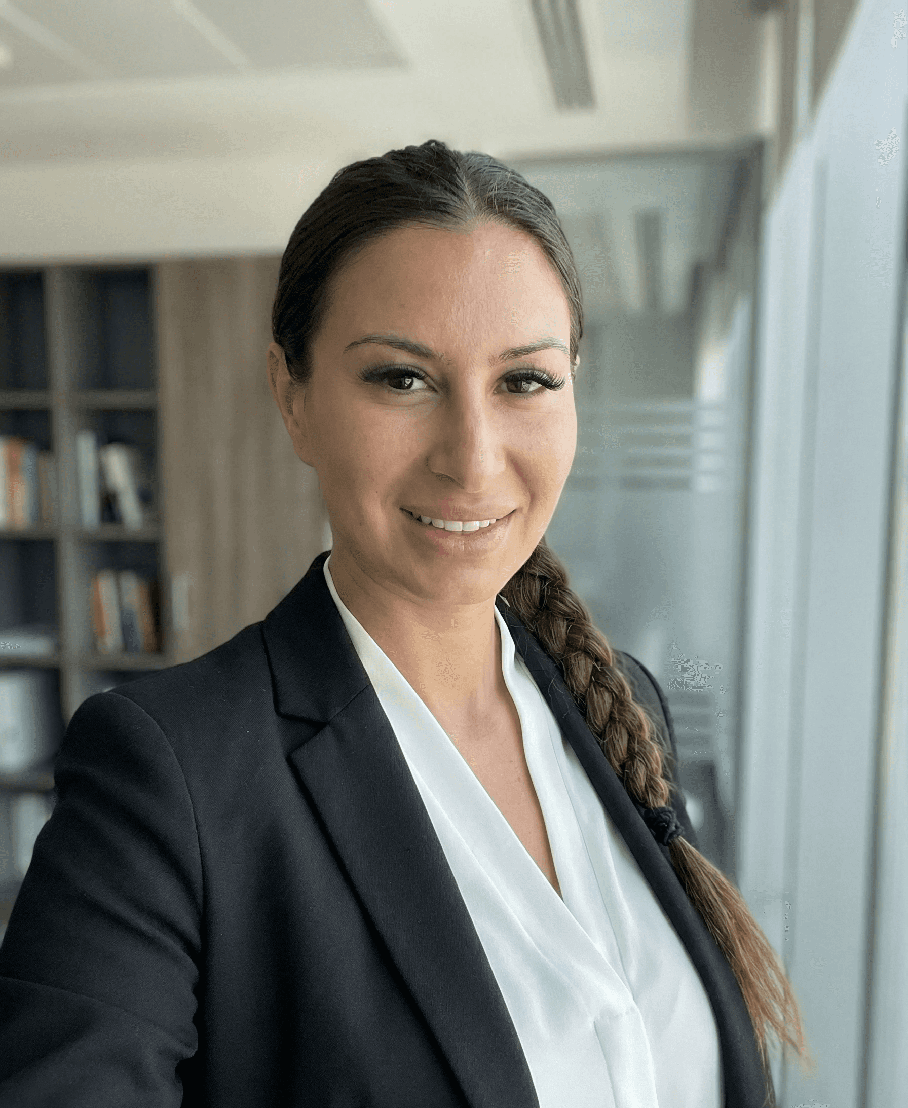 Man wearing red cap and top writing on a note pad