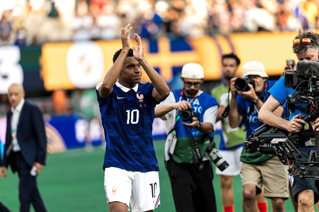 Kylian Mbappé applauds fans after France's 3-0 World Cup win over Sweden