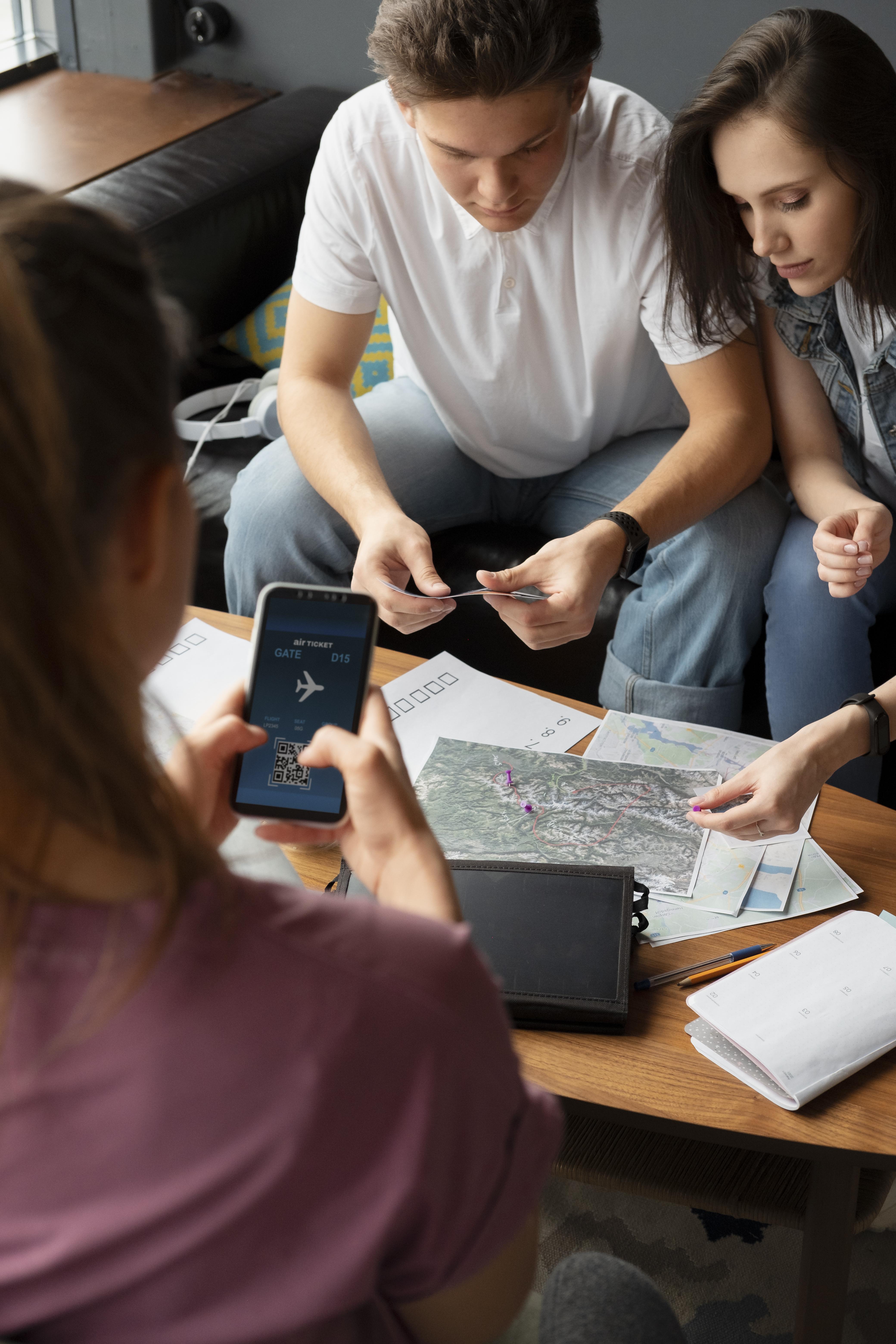 Two businessmen shaking hands in a modern, sunlit office setting.