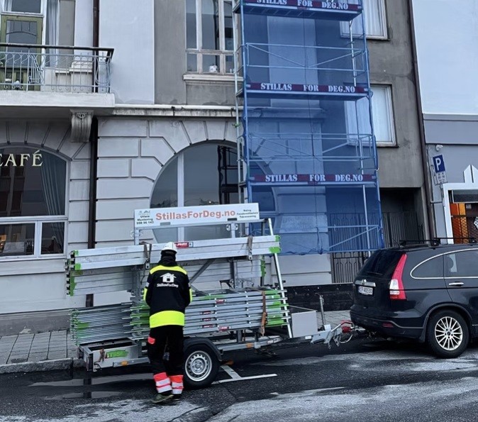 two men working on the roof of a house