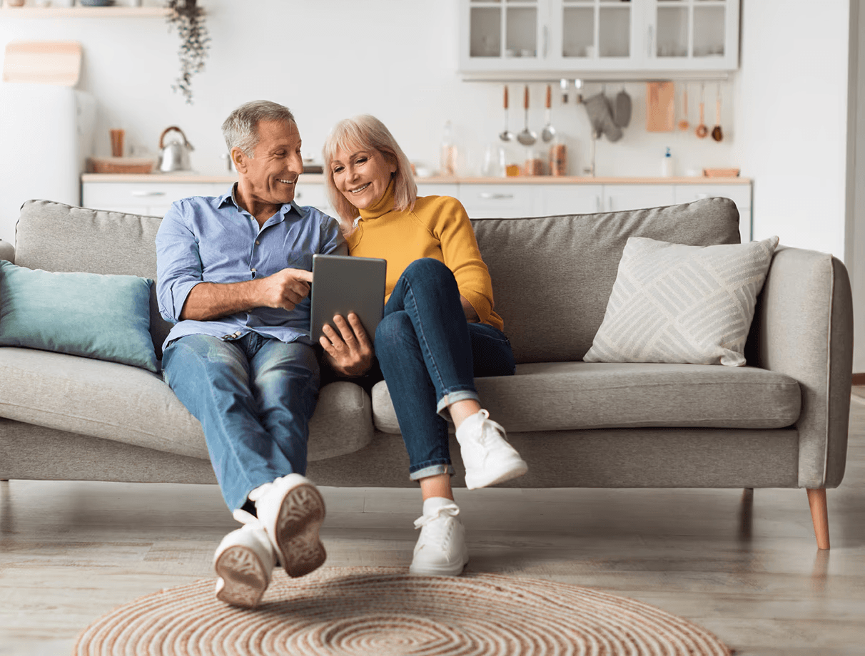 Couple researching Harper Health concierge medicine services online.