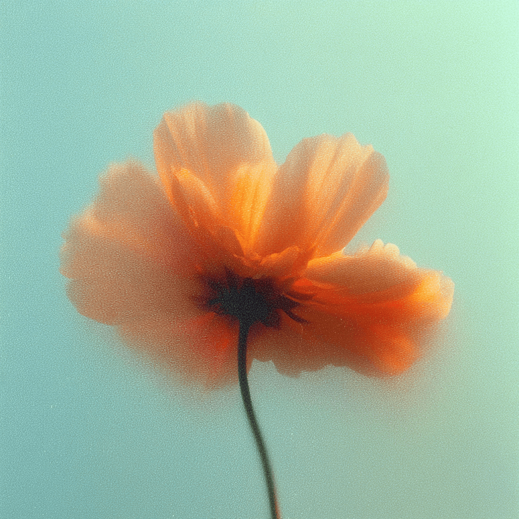 Close-up of peachy ethereal flower against green background.