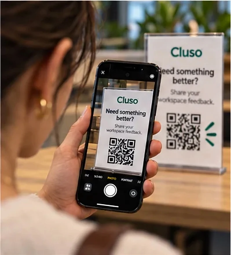 She scans the QR code with her phone camera.