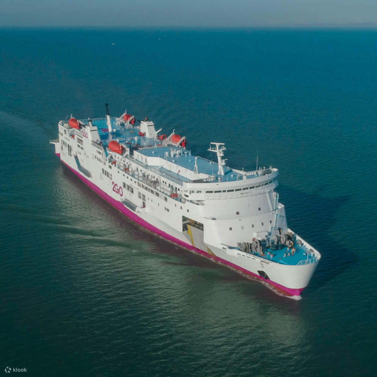 lighted cable bridge near high-rise buildings