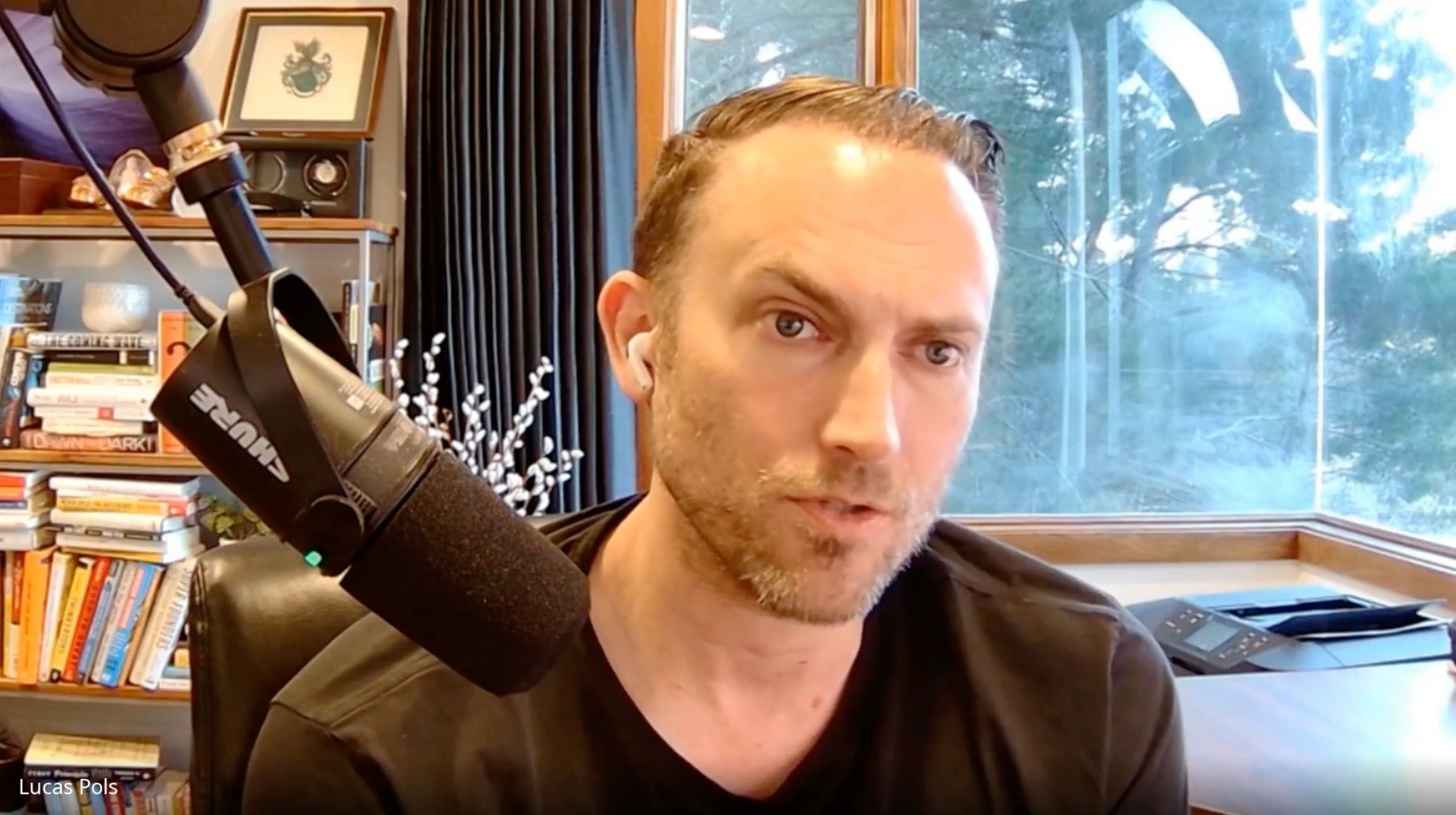 a black and white living room with a large tv