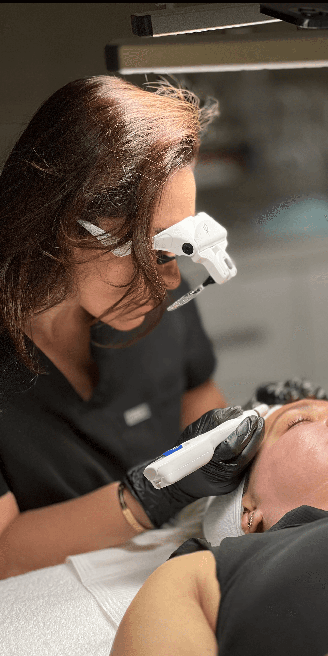 woman doing liposuction on her face