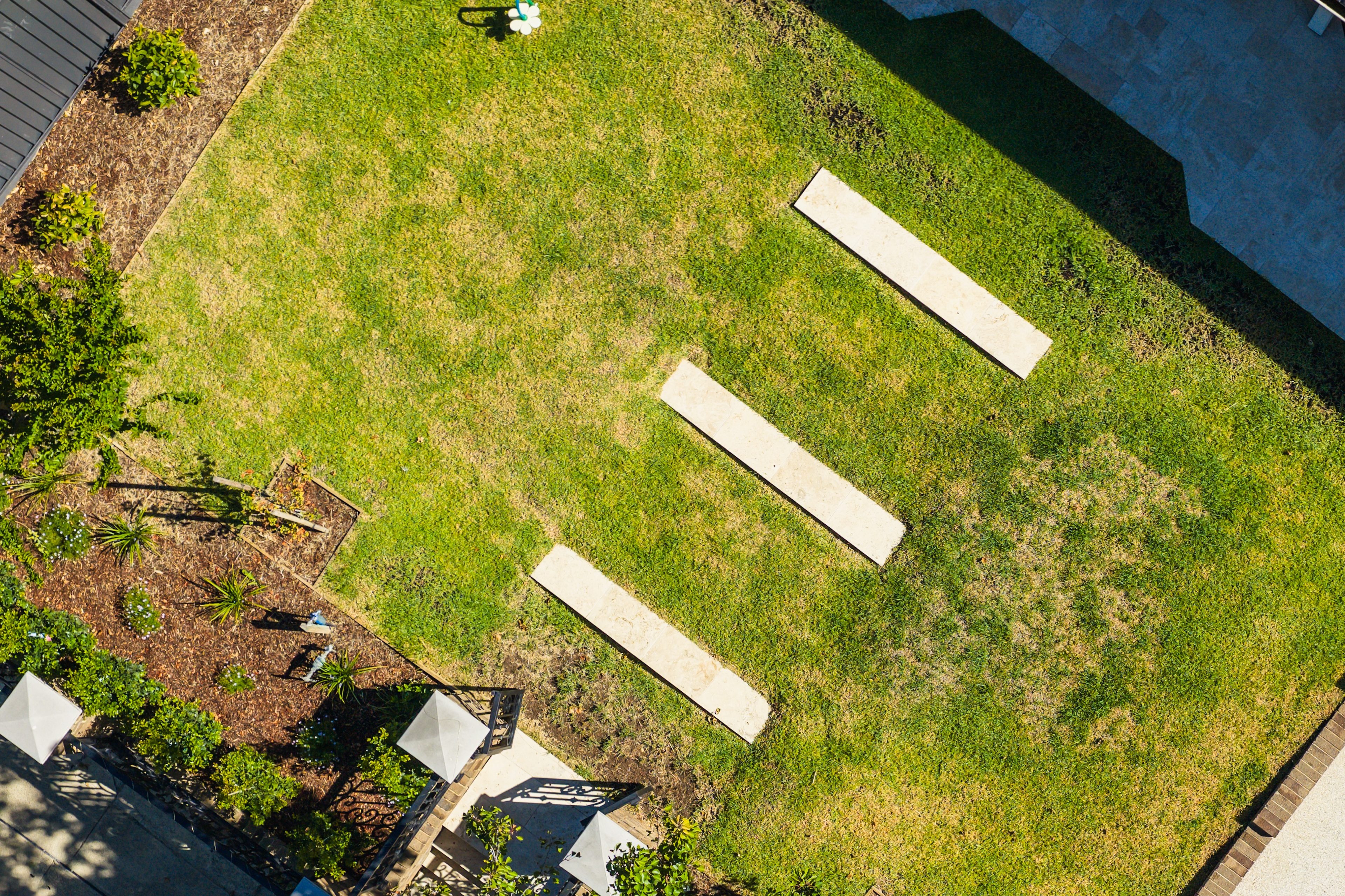 A contemporary house nestled in the woods, with wooden panelling and atmospheric outdoor lighting