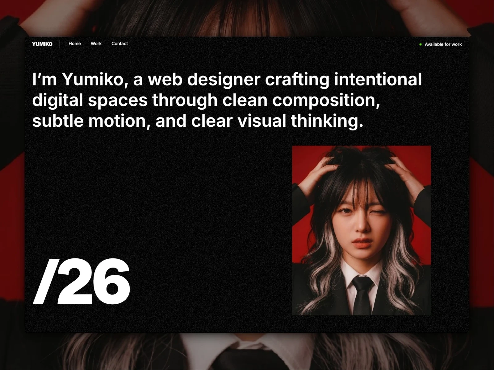 Yumiko dark portfolio homepage with bold introduction, portrait photography, and interactive design