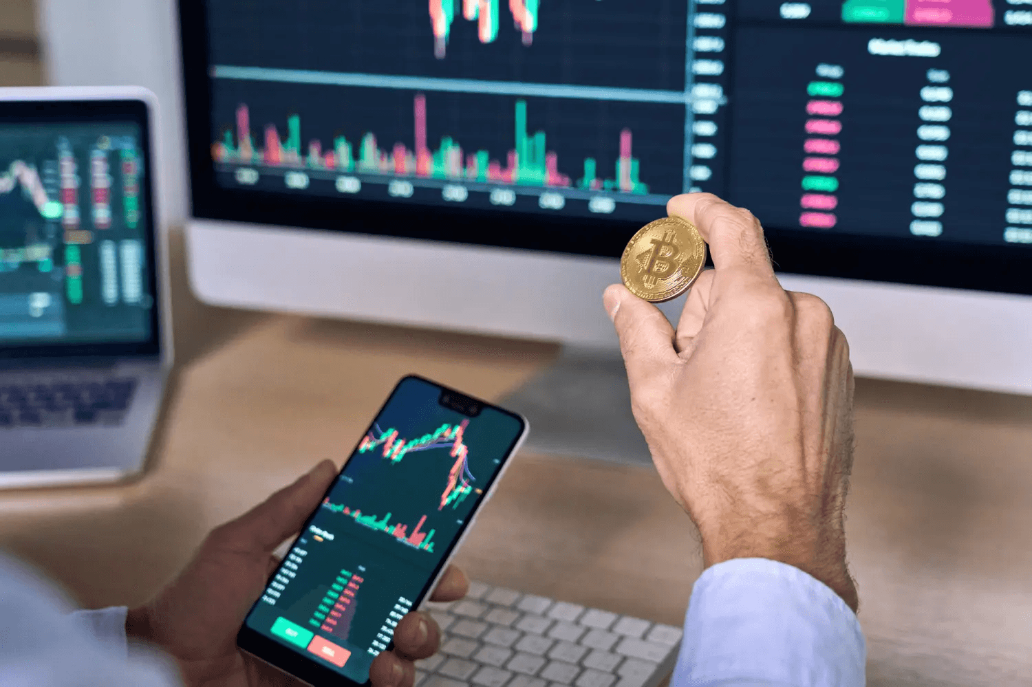 Trader holding physical Bitcoin near charts - DEXTools Alternative